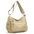 Sac bandoulière en nylon beige, large sangle et plusieurs poches zippées sur le devant - Beige