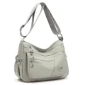 Sac bandoulière gris en nylon avec trois poches zippées, sangle réglable et poche latérale - Gris