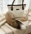 Real fur fox tail bag charm with gold clasp, fading from light brown to dark brown and a white tip - Sun Fox Tail