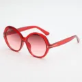 Oversized round sunglasses with translucent red frames, pink gradient lenses and gold T accents - UV400 Protection / Transparent Red Frame Double Red Lenses