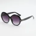 Black round sunglasses with purple gradient lenses and gold T-shaped accents, shown at an angle - UV400 Protection / Black Frame Gradient Grey Lens