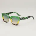 Green-yellow cat-eye sunglasses with leopard-print temples and gradient lenses, shown at an angle - Green Pattern Frame Green To Yellow Lens