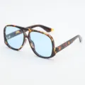 Occhiali da sole a doppio ponte, fantasia leopardata e lenti azzurre, mostrati di tre quarti - UV400 protezione dai raggi UV / Montatura Tartaruga Lente Blu