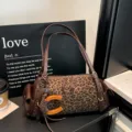 Leopard-print pillow shoulder bag in coffee brown with dark leather-look straps and wooden charm - Without Pendant / 32x11x14cm / Leopard Print