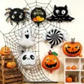 Halloween foil balloons shaped as spiders, bats, ghosts, pumpkins and candy hang on a web backdrop - 30pcs Mixed Pack (Free Pump + Ribbon)