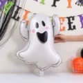 White foil ghost balloon with a smiling face displayed beneath colorful Halloween party lettering - Ghost Foil Balloon / 2 Pieces Set (75cm*59cm)