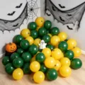 Dark green and bright yellow Halloween latex balloons arranged with spiderweb and bat decorations - Matte Dark Green and Matte Yellow