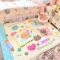 Pastel cartoon rug beside a bed, printed with cats, a bear, hearts, stars and pencil doodles - 60x40cm / Pink Blue Pets (FDDA097402)