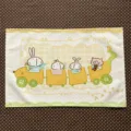 Flat-lay view of a cute animal train print with yellow and green lace trim on soft fabric - Rabbit and Train (MZBA072401) / 40x30cm