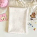 Flat lay of white fabric with pale pink checks, styled with yarn, lace and cute craft accents - 30x20cm / Multifunctional Pot Mat / Pink Plaid