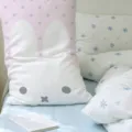 Pink and white rabbit-shaped body pillow with a cute face and gray star print, shown on a bed - 50x30cm (Without Core) / Pink