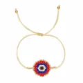 Pulsera de cuentas con ojo redondo en rojo, azul, blanco y negro y cordón dorado ajustable - Estilo Ojo Redondo Rojo Azul Blanco (MI-B220449A)