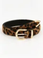 Leopard-print belt laid flat, showing its textured surface, black lining, and gold-tone buckle - Round Buckle with Tail Clip / 105x2.7x0.2cm / Leopard Print Style D