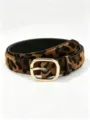 Leopard-print belt coiled on white, showing its black lining and polished gold oval buckle. - Oval Buckle / 100x2.7x0.2cm / Leopard Print Style B