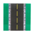 Building block road baseplate with green studded sides, gray asphalt and yellow dashed centerline - Asphalt Road