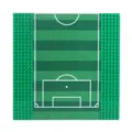 Green building-block baseplate with a printed soccer field and visible studs along both sides - Football Field
