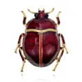 Front view of a red enamel beetle brooch with gold-tone detailing and sparkling rhinestone accents - Beetle Shape Brooch (A147-D) / Red (A147-D)