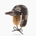 Brown plaid winter aviator hat with plush lining, ear flaps and chin ties, shown from the front - One Size (56-60cm) / Coffee Plaid
