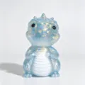 Front view of a blue glittery dragon figurine with gold flecks and a white striped belly - Maltose Dinosaur / Blue
