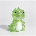 Green translucent glitter dinosaur figurine with a white striped belly and glossy black bead eyes - Maltose Dinosaur / Green