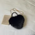 Black heart-shaped bag with shaggy faux-fur texture, woven handle and gold chain strap - Black