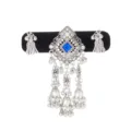 Close-up of the silver ornament's blue square gem, rhinestone accents and dangling bell tassels - Sapphire Blue