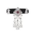 Silver-tone filigree pendant with red stone and dangling tassels and bells on a black velvet band - Red