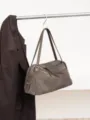 Taupe suede-textured handbag with leather handles and twin zippers, hanging beside a brown jacket - 35x12x23cm / Gray