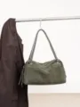 Green suede Boston shoulder bag with matching handles, silver hardware, and a decorative tassel - 35x12x23cm / Green