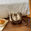 Beige bucket bag with brown braided leather straps, drawstring closure and gold-tone hardware - No Pendant / Off White