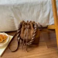 Brown suede bucket bag with diamond quilting, braided handle, drawstring and gold-tone hardware - No Pendant / Brown