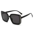 Oversized black square sunglasses with dark gray lenses and silver accents, shown at an angle - Black and Gray