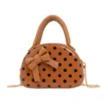 Front view of a tan mini bag with black polka dots, bow detail, top handle and gold-tone chain strap - Brown