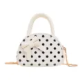 Front view of a white mini bag with black polka dots, bow detail and gold chain strap - White