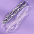 Silver floral rhinestone bridal belt with double-row clusters and sheer white ribbon ties, laid flat - Simple Daily Girl Style (WS-J280S)