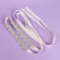 Ivory satin bridal waist belt with sparkling rhinestones and faux pearl floral details, laid flat - Luxury Floral Versatile Style (WS-J207S)