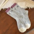 Thick gray wool-blend crew socks with mauve cuffs, cream toes, and colorful MORE lettering - One Size / Light Gray