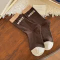Brown knit mid-calf socks with beige contrast cuffs and toes, featuring MORE jacquard lettering - One Size / Dark Coffee