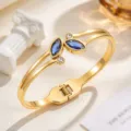 Gold-tone stainless steel open cuff bracelet with blue marquise stones and clear round accents - Dark Blue (SZ6143)