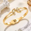 Gold-tone stainless steel open cuff bracelet with marquise clear stones and double-line design - Yellow (SZ6143)
