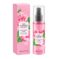 Brume capillaire lissante sans rinçage, flacon rose à motif floral et boîte assortie sur fond blanc - Parfumé à la Rose