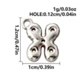 Silver bubble-letter X charm in 316L stainless steel, with a small loop for DIY jewelry - Letter X / Steel