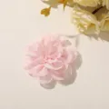 Overhead view of a layered pink chiffon flower with softly ruffled petals on a cream surface - Style 1(A35-4-1-5) / 1 Piece/Pack