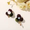 Close-up of velvet fabric balls and satin buds with gold-tone stems and wooden bead accents - Style 12 (202610)