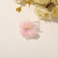 Close-up of a pink sheer fabric flower with a pale yellow center on a light neutral surface - Style 5(A27-4-1-8) / 1 Piece Pack