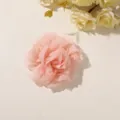 Layered pink chiffon flower on a white surface, with yellow blossoms visible in the background - Style 9(A35-5-4) / 1 Piece Pack