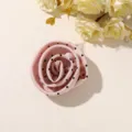 Close-up of a layered pink fabric rose with black dots, arranged flat beside cream flowers - Style 11(A73-5-13-16) / 1 Piece Pack