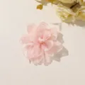 Layered pale pink fabric flower with softly gathered petals, shown on a light tabletop - Style 19(A75-4-1-5) / 1 Piece Pack