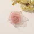 Close-up of a layered pink tulle rose with white mesh accents, arranged on a pale surface. - Style 25(A15-4-5-10) / 1 Piece Pack