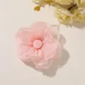 Overhead view of a pink sheer fabric flower with layered ruffled petals and a rolled center - Style 30(A75-2-14-19) / 1 Piece Pack